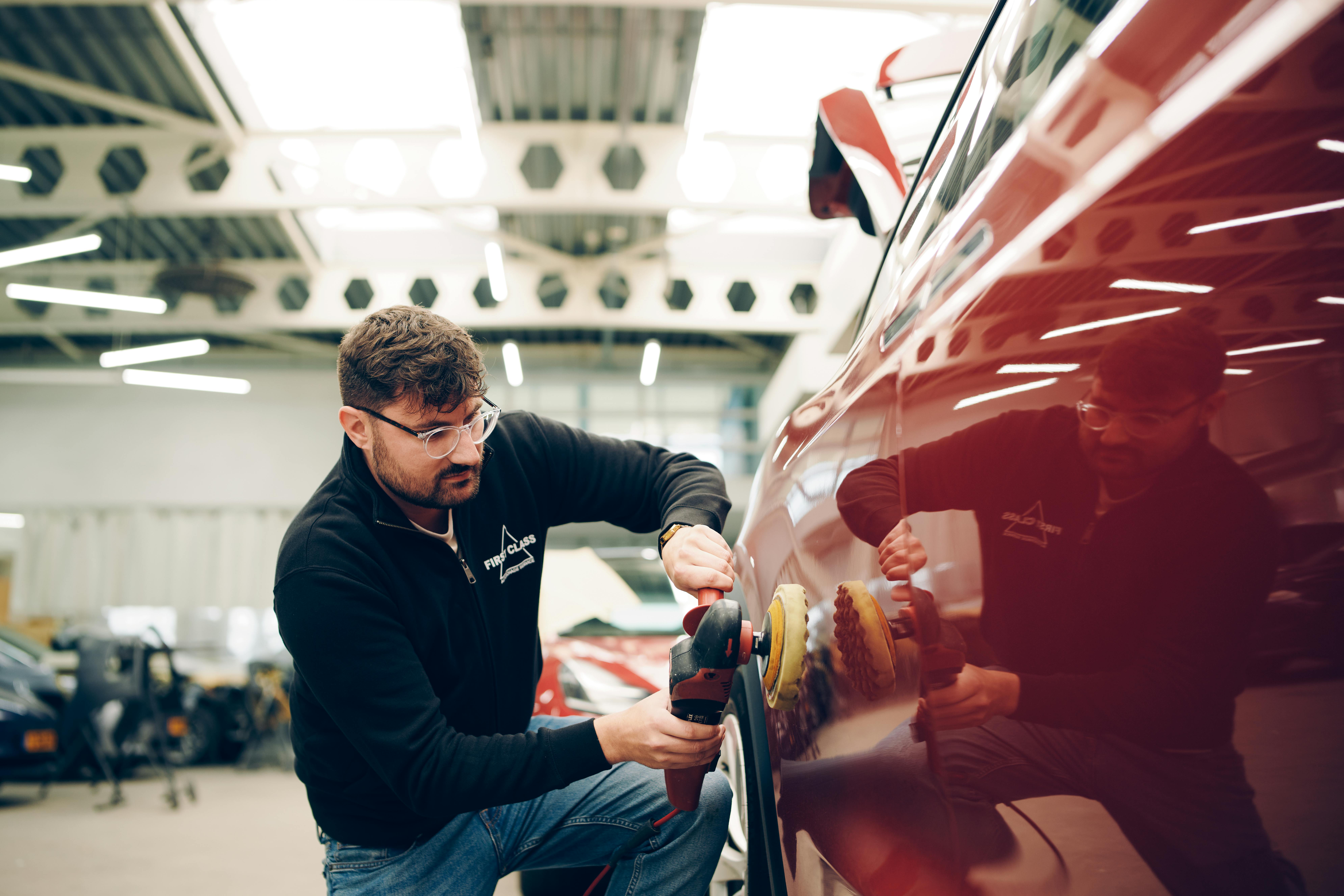 Repairers working on vehicle